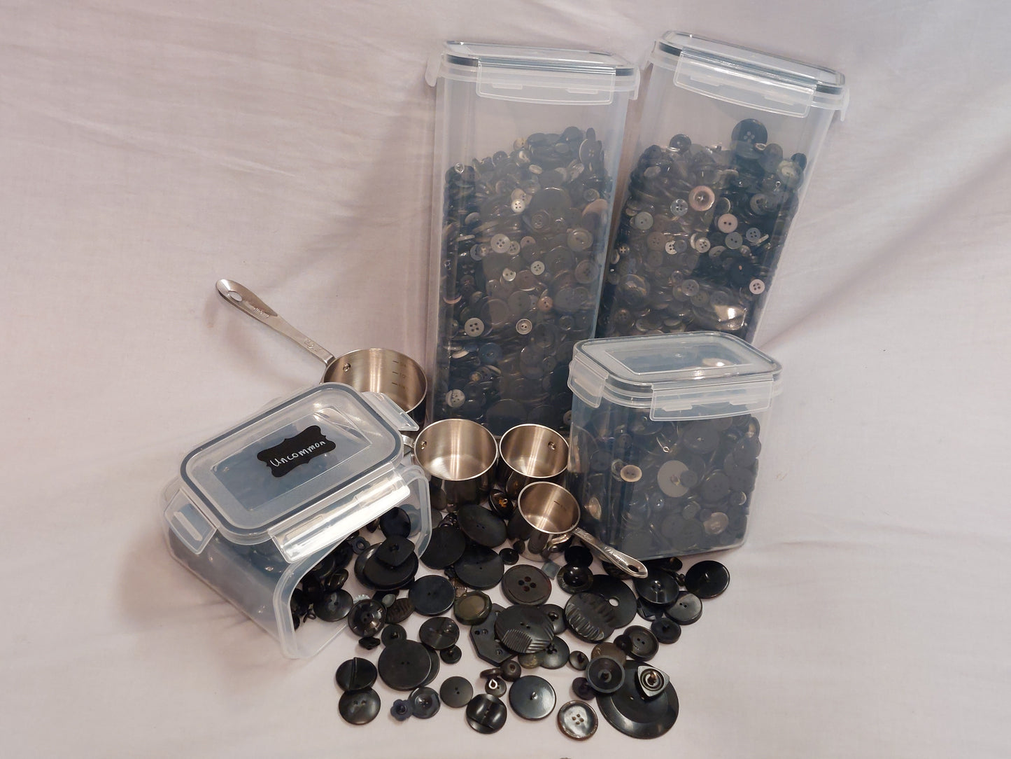 Single Color- Black. Includes Unique/ Uncommon Buttons